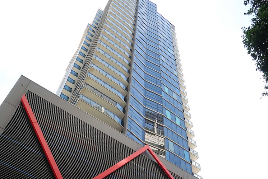 Photo looking from the front entrance up the tower of the Tiara apartment building in Melbourne