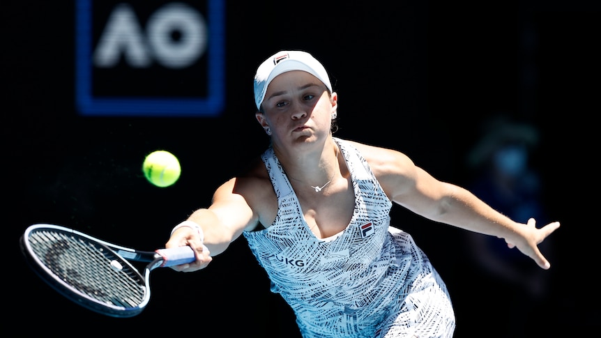 Australian tennis player Ash Barty plays a forehand in her second round singles match at the Aus Open