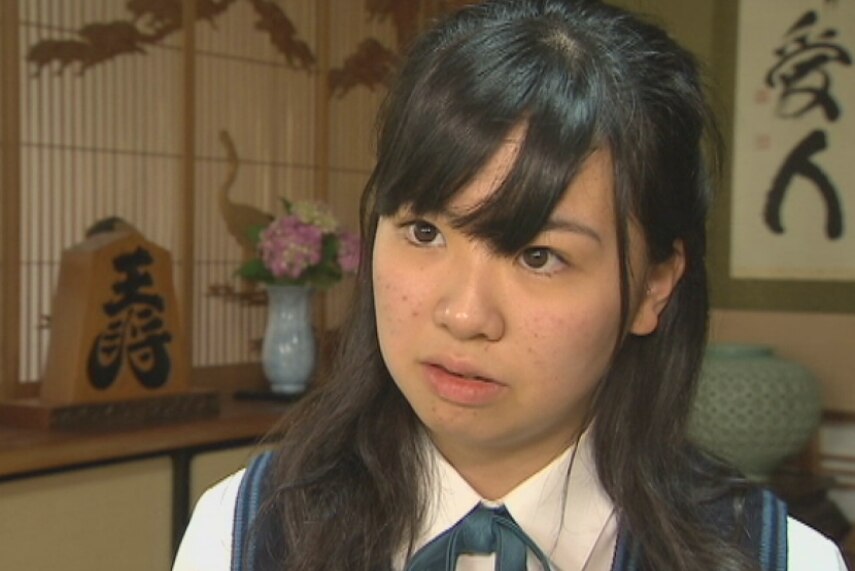 A 16-year-old Japanese school girl in her home.
