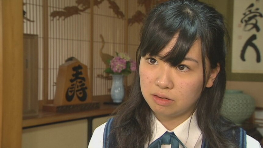 A 16-year-old Japanese school girl in her home.
