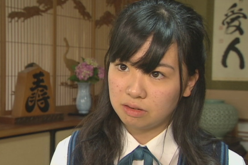 A 16-year-old Japanese school girl in her home.