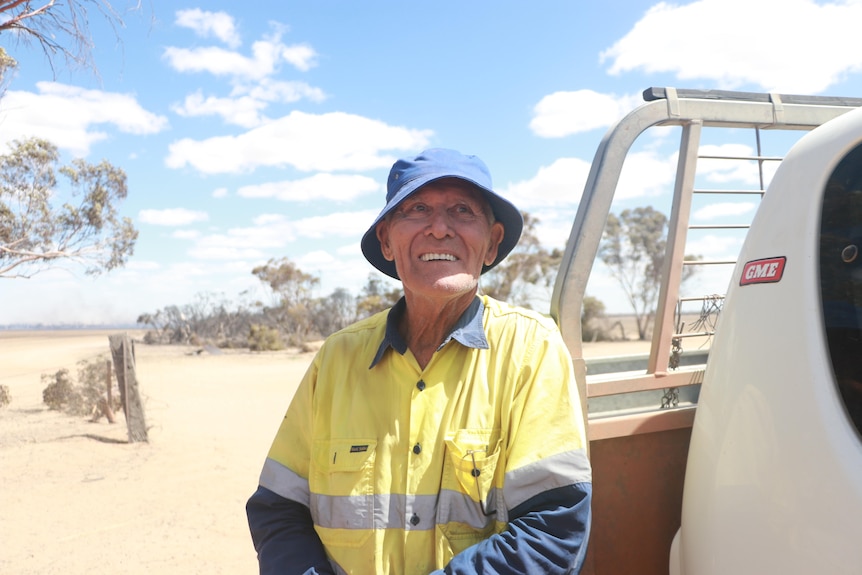 A man standing in front of a ute 