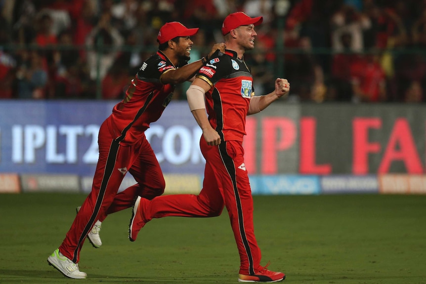 AB de Villiers celebrates a catch for Royal Challengers Bangalore