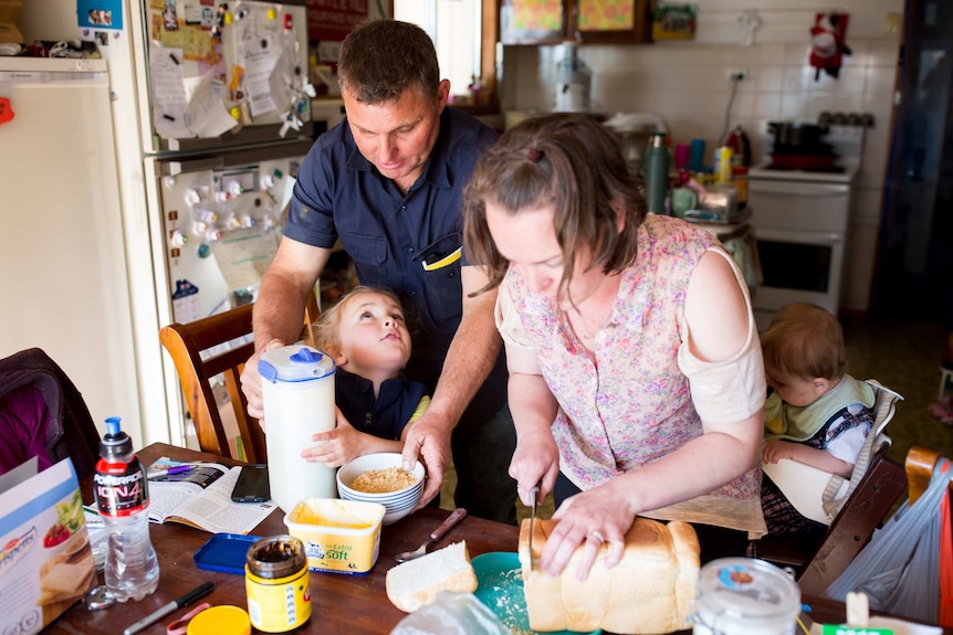 Shane Attwell steals a few chaotic moments for breakfast with his youngest children and Cindy