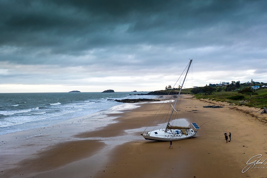 A large yacht washed up on a beach