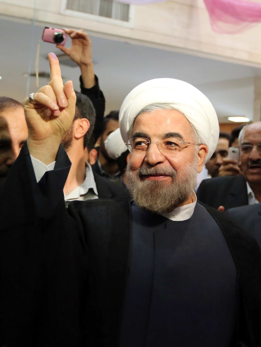 Hassan Rowhani votes in Iran poll