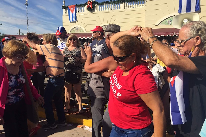 Cuban exiles dance on the street after the death of Fidel Castro in Little Havana, Miami.