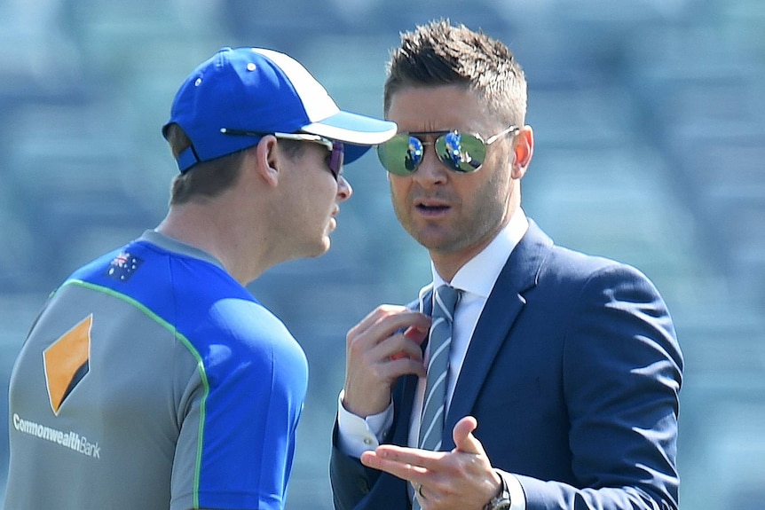 Steve Smith speaks to Michael Clarke