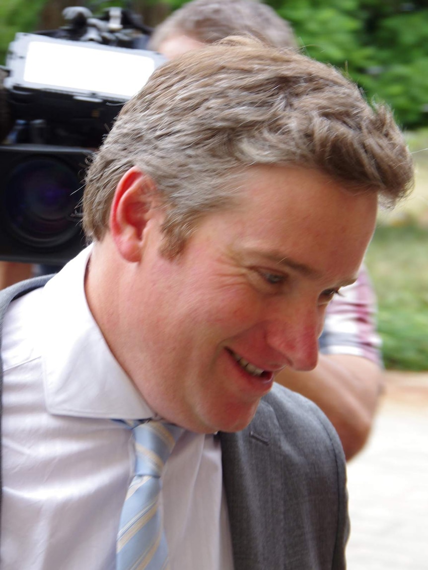 Brendon Grylls brushes past reporters on his way to Parliament