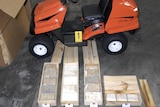 Some of the 270 kilograms of cocaine sits next to one of the lawnmowers in which it was hidden