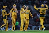 Three-peat: Johnson and the Aussies celebrate Shah's hit-wicket dismissal.