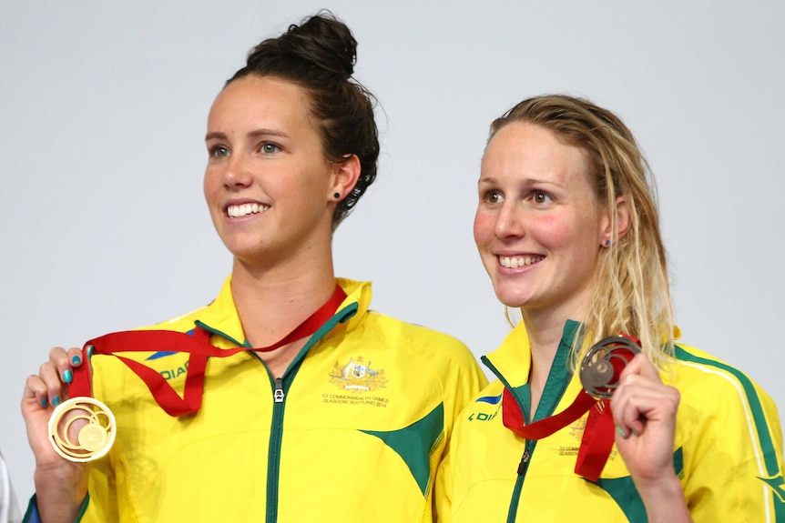 Emma McKeon and Bronte Barratt with their medals