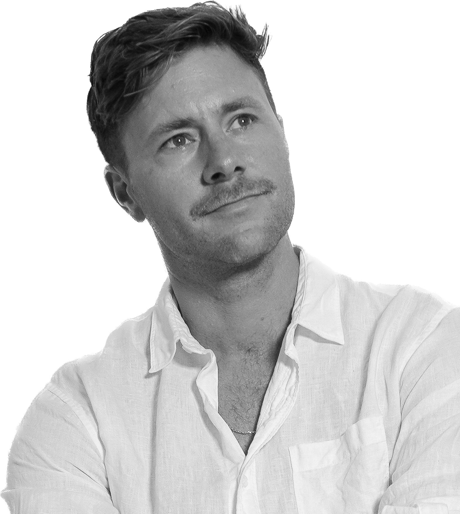 A black and white image of a man with a moustache look up to the right