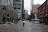 Forced to flee: a man walks down a nearly empty street in New York City