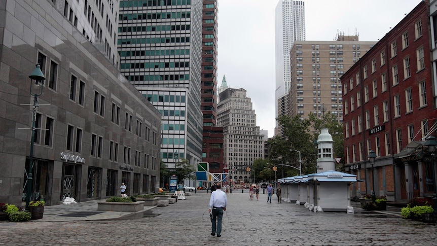 Forced to flee: a man walks down a nearly empty street in New York City