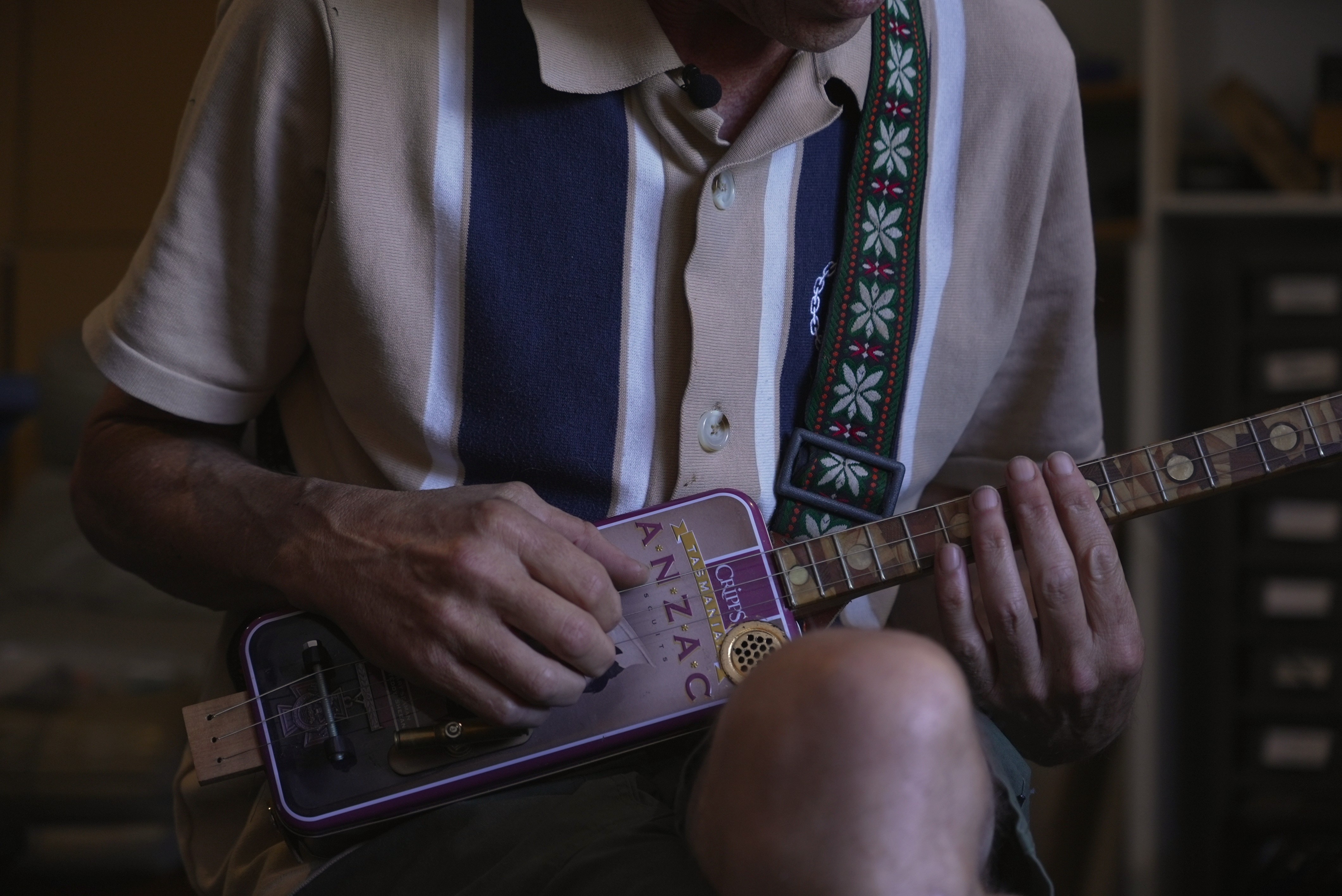 Anzac biscuit-tin guitars sold to aid veteran charity