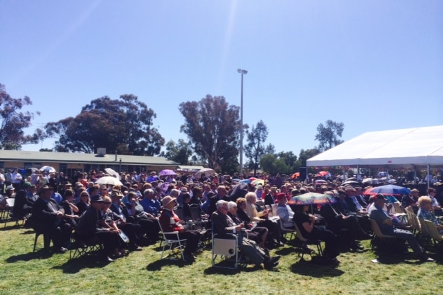 Mourners gather at the Hunt family memorial