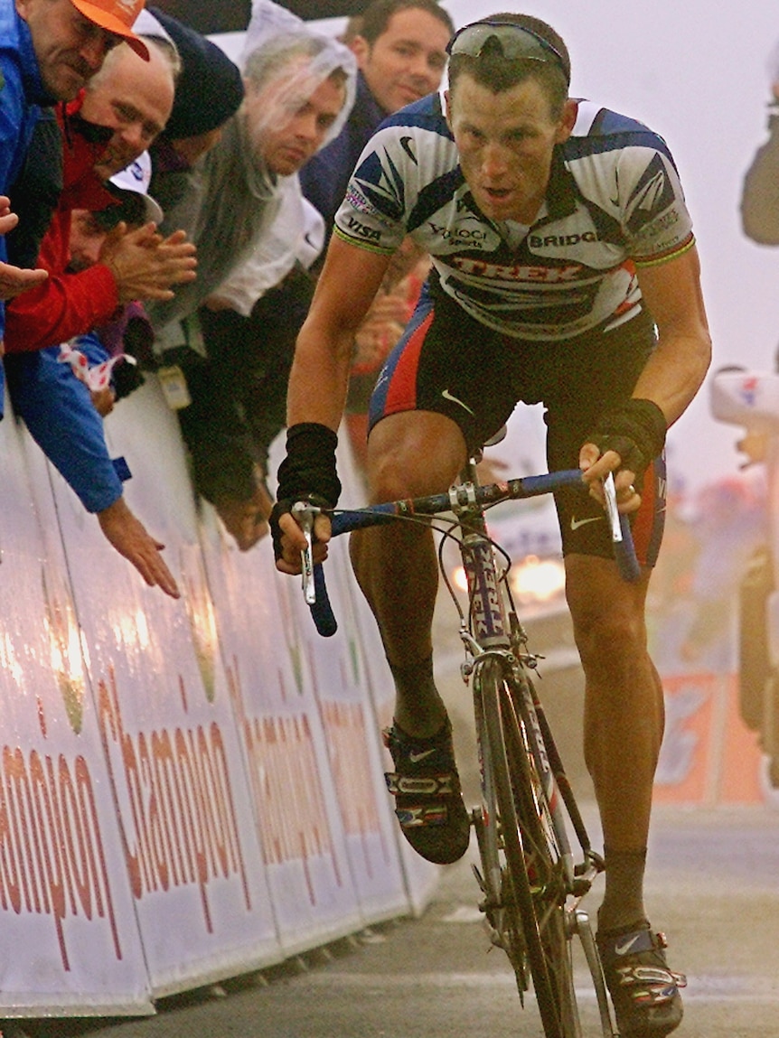 Lance Armstrong crosses the finish line of the 10th stage of the 87th Tour de France in Lourdes-Hautacam.