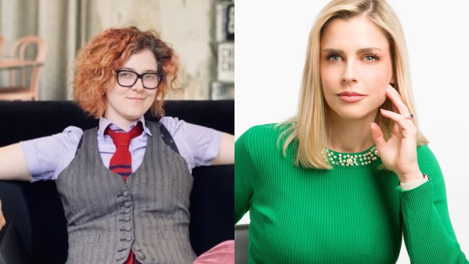 A woman with dyed red hair and glasses in a tie and suit vest and a woman with blonde hair and a green sweater