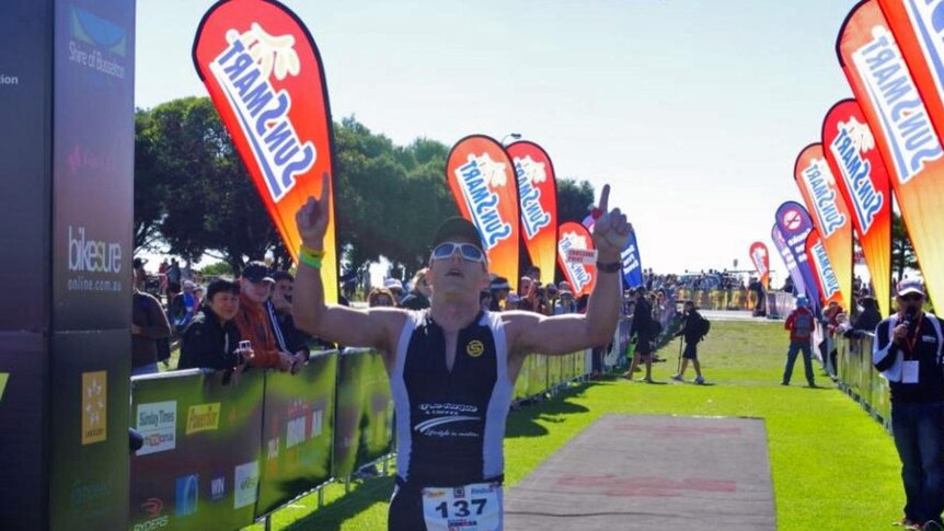 Busselton ironman competitor crosses the finish line