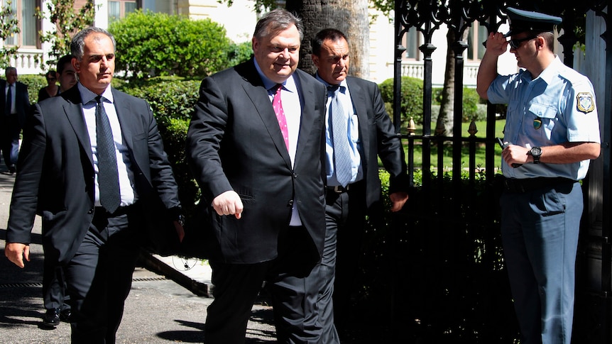 The head of Greece's Socialist PASOK party, and former finance minister Evangelos Venizelos, leaves the Presidential palace.