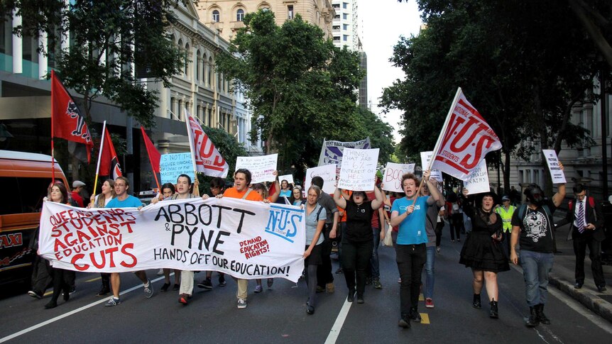 University students protesting the budget march through the Brisbane CBD.