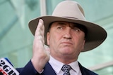 Barnaby Joyce looks mad as he speaks to the media about his affair