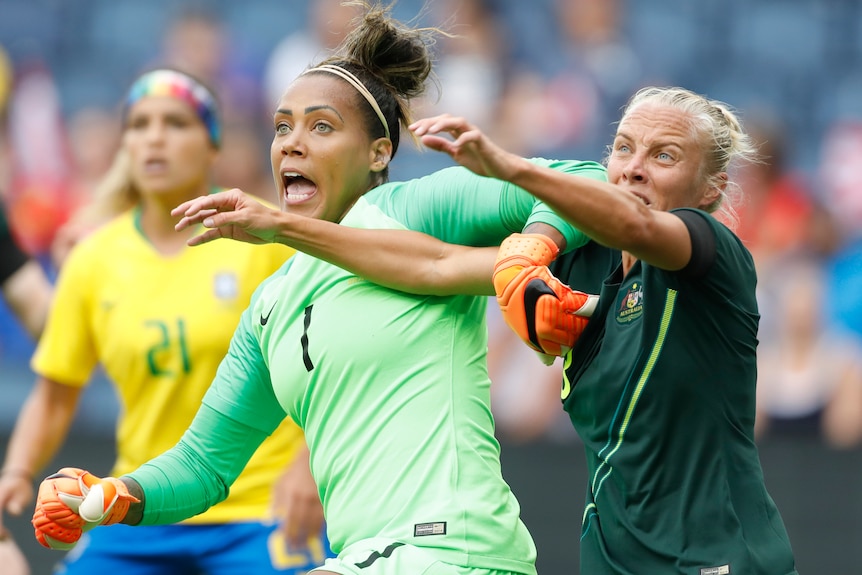 Tameka Butt battles for possession against Brazil