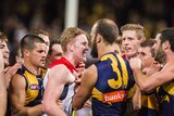 Melbourne's Clayton Oliver and West Coast's Will Schofield confront each other at Subiaco.