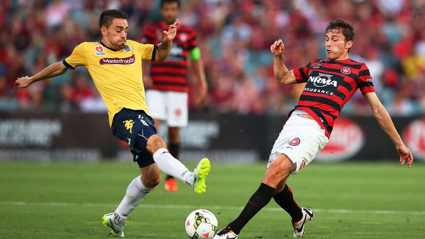 Mateo Poljak of the Wanderers competes with Anthony Caceres of the Mariners