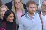 Prince Harry and Meghan at an airport