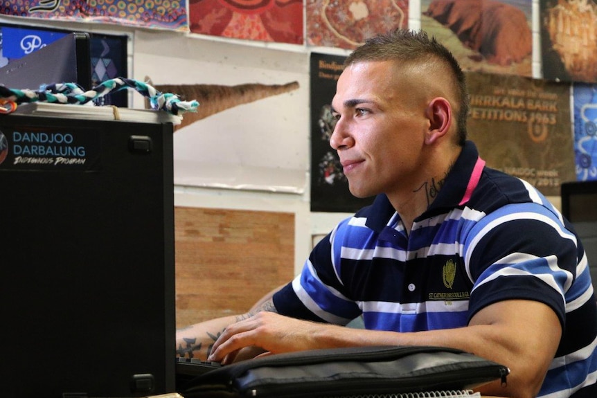 Marlon Johns working at a computer in the indigenous study room at St Catherine's college
