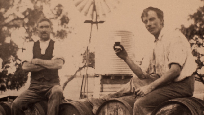 Two men enjoying a drink.