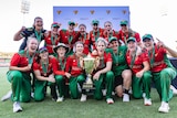 The Tasmanian team pose for a photo with the WNCL trophy.