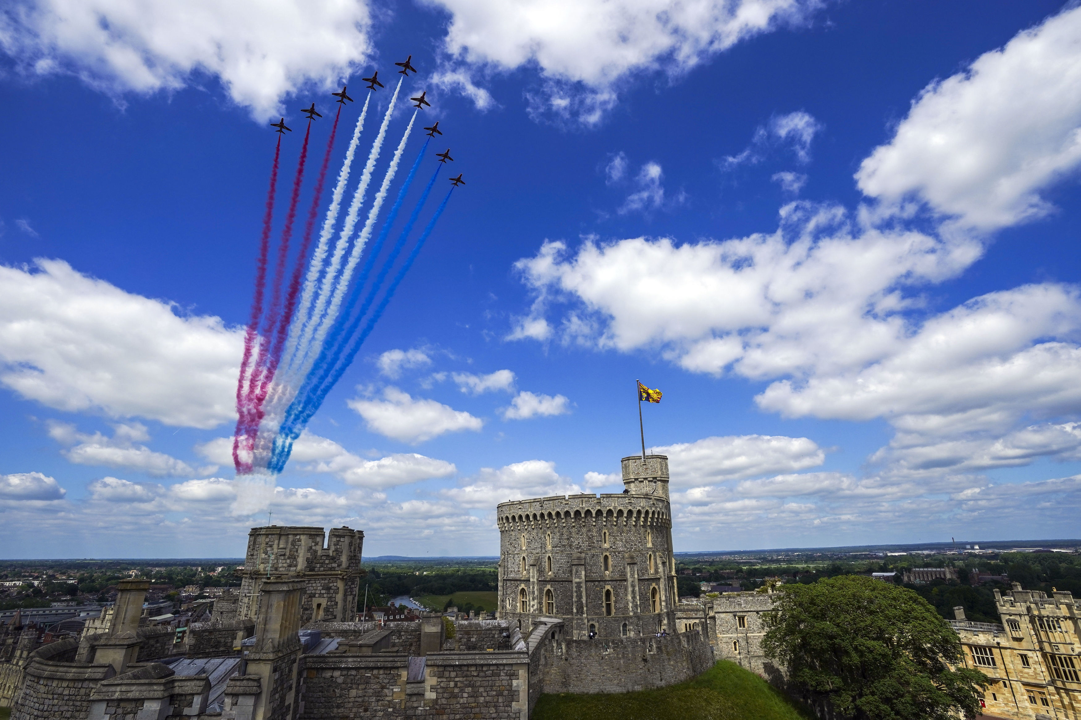 The Red Arrows fly over Windsor Castle during the military ceremony.