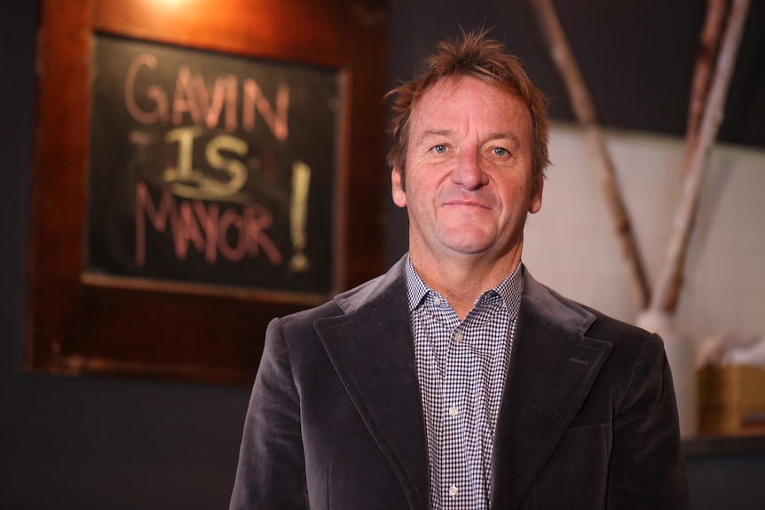 Australian-born Gavin Buckley, mayor of Maryland's capital Annapolis, with blackboard saying 'Gavin is Mayor'