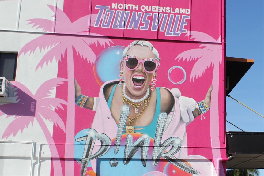 A mural of P!nk on a building it says Pink Townsville