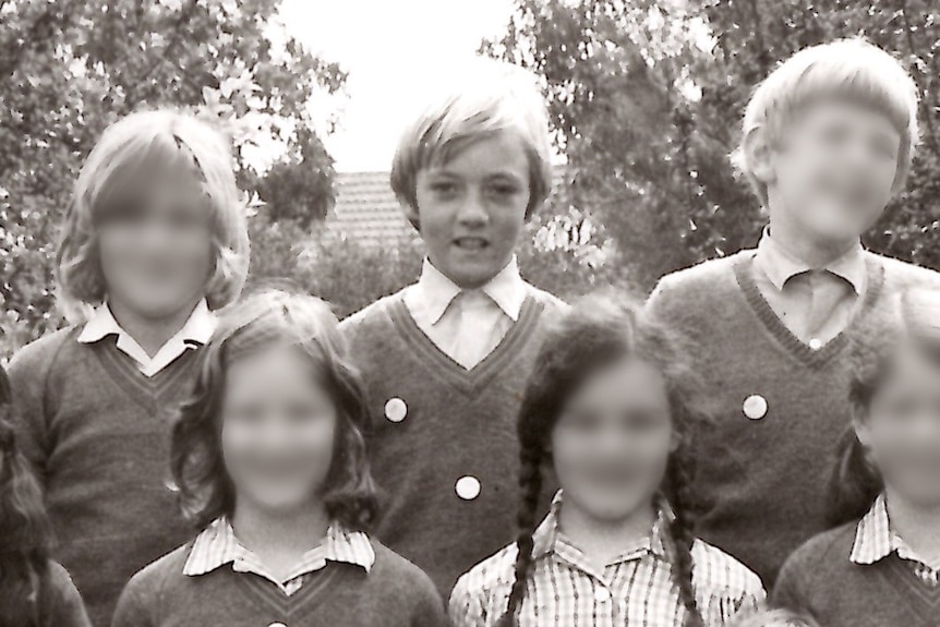 A black and white school photo of Glen Fearnett and his class.