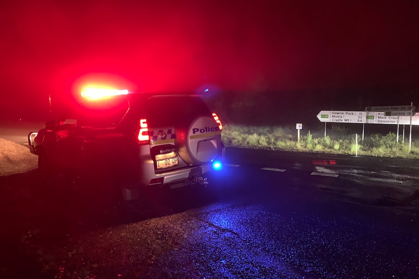 A police car on the road near the Targa Tasmania crash.