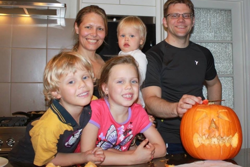 Forsythe family carve a pumpkin for Halloween