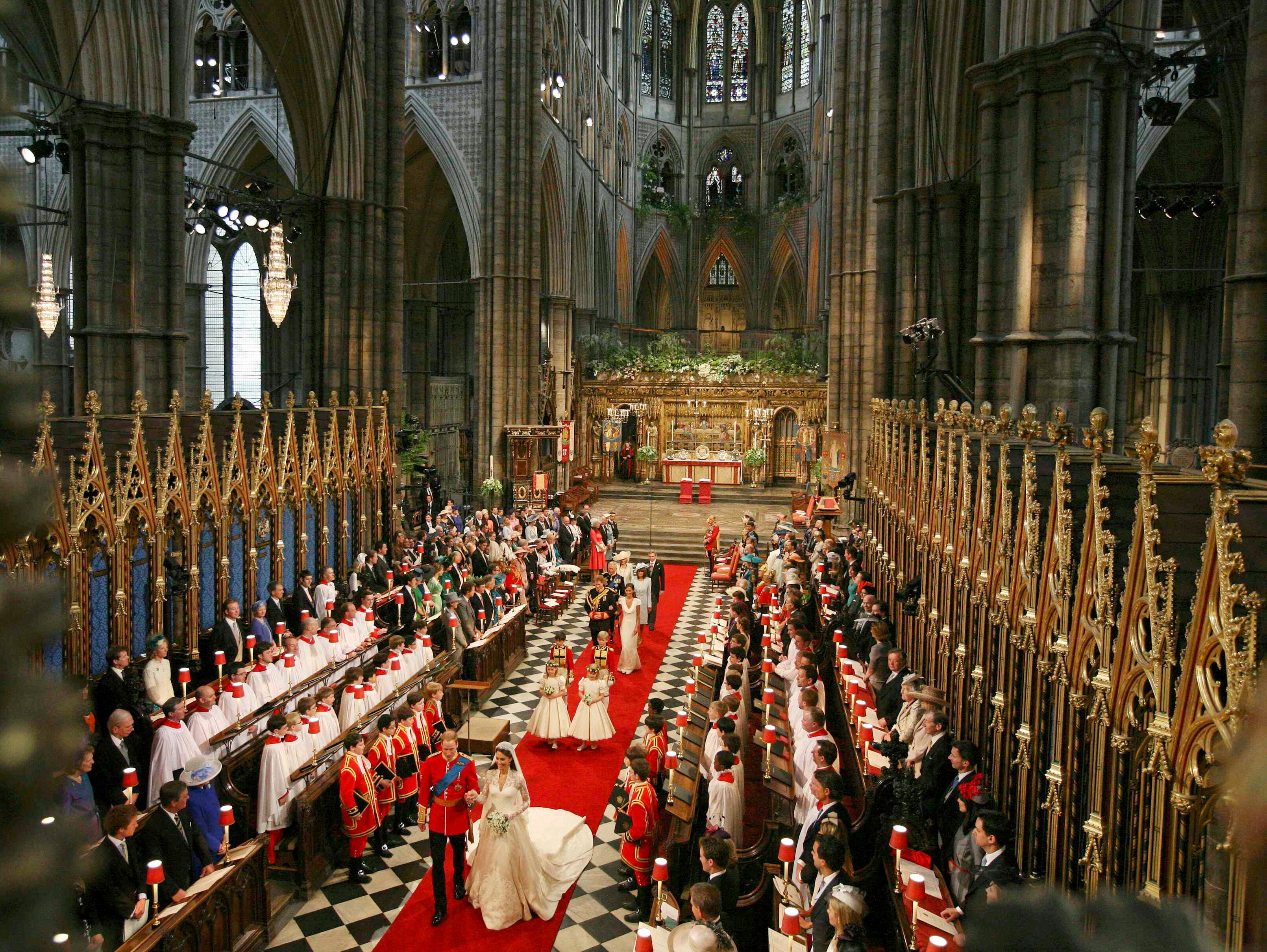 Prince William and Catherine Middleton walk down the aisle at their wedding in Westminster Abbey.