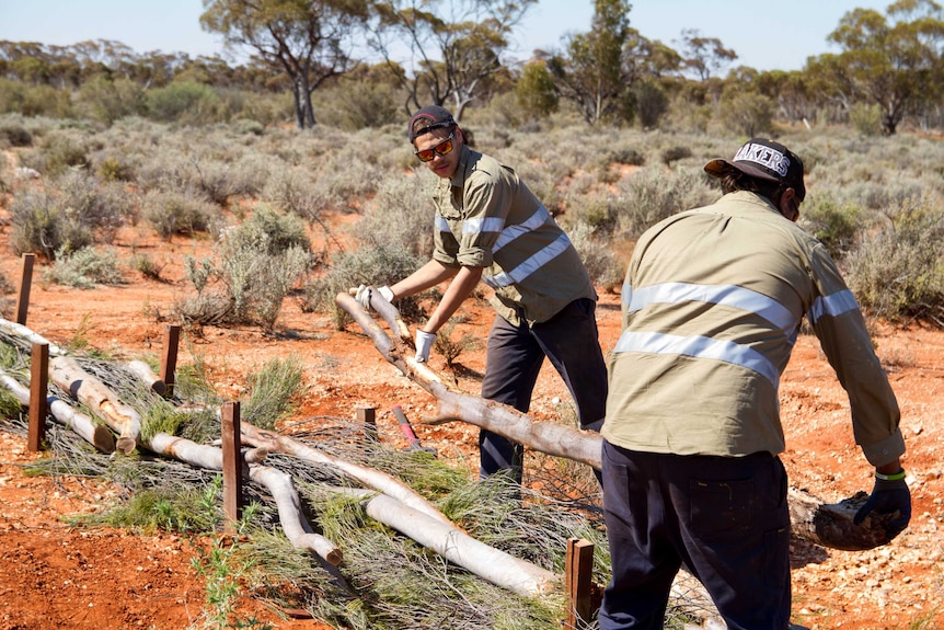 Jayden and Neil Donaldson working to prevent soil erosion on Credo Station.