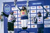 Jakara Anthony on top of the podium after winning World Cup gold in Sweden, with the two minor medalists alongside her.