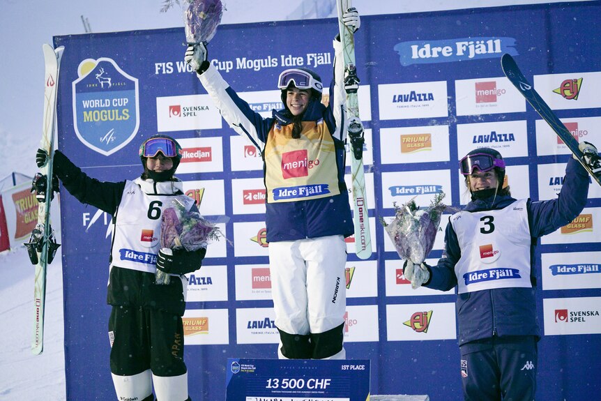 Jakara Anthony on top of the podium after winning World Cup gold in Sweden, with the two minor medalists alongside her.