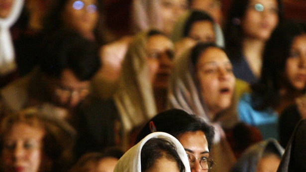 A woman prays during a church service in Cairo. About seven million Christians account for up to 10 per cent of Egypt's population.