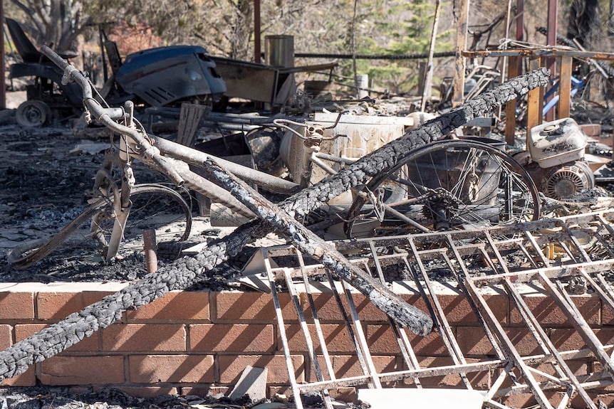 Bushfire-damaged bike and other property at Ray Zanatta's hydroponic coriander farm at Stanthorpe.