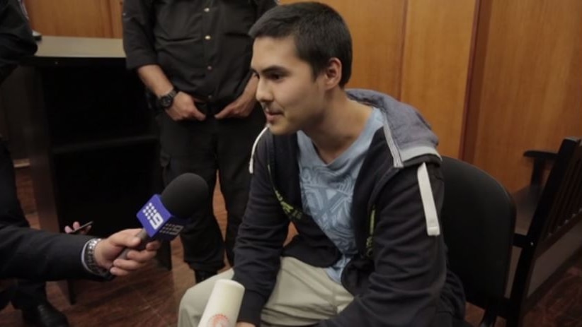 Dual Australian-Bulgarian citizen John Zakhariev talks to reporters after being charged with terror offences in Bulgaria.