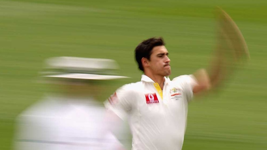 Plenty of toil... Mitchell Starc sends down a delivery.