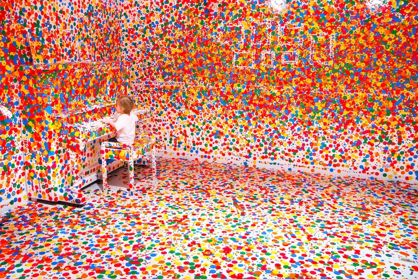 A child plays in Yayoi Kusama’s 'The obliteration room' at GoMA (Audience submitted: Stuart Addelsee)