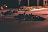 A motorbike lies on the road in Perth Tasmania after a double fatality.
